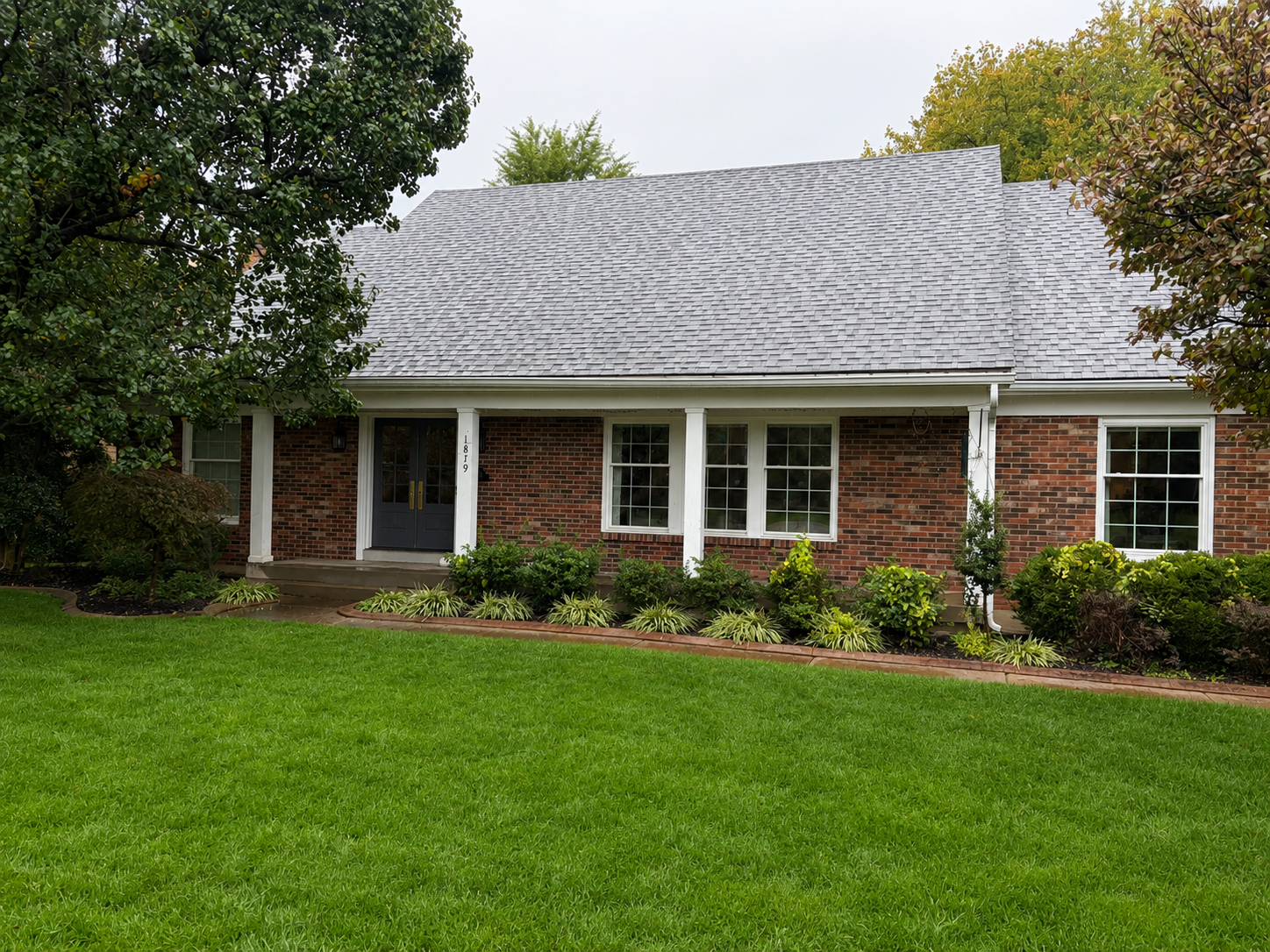 Charming Gable & Dormer Addition — before photo showing original brick ranch exterior without gable or dormer by Luxe Built Louisville KY