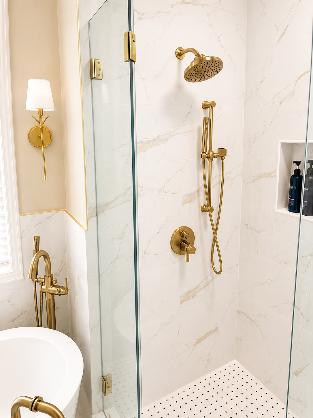Elegant Bathroom — shower detail with brass fixtures and marble tile by Luxe Built Louisville KY