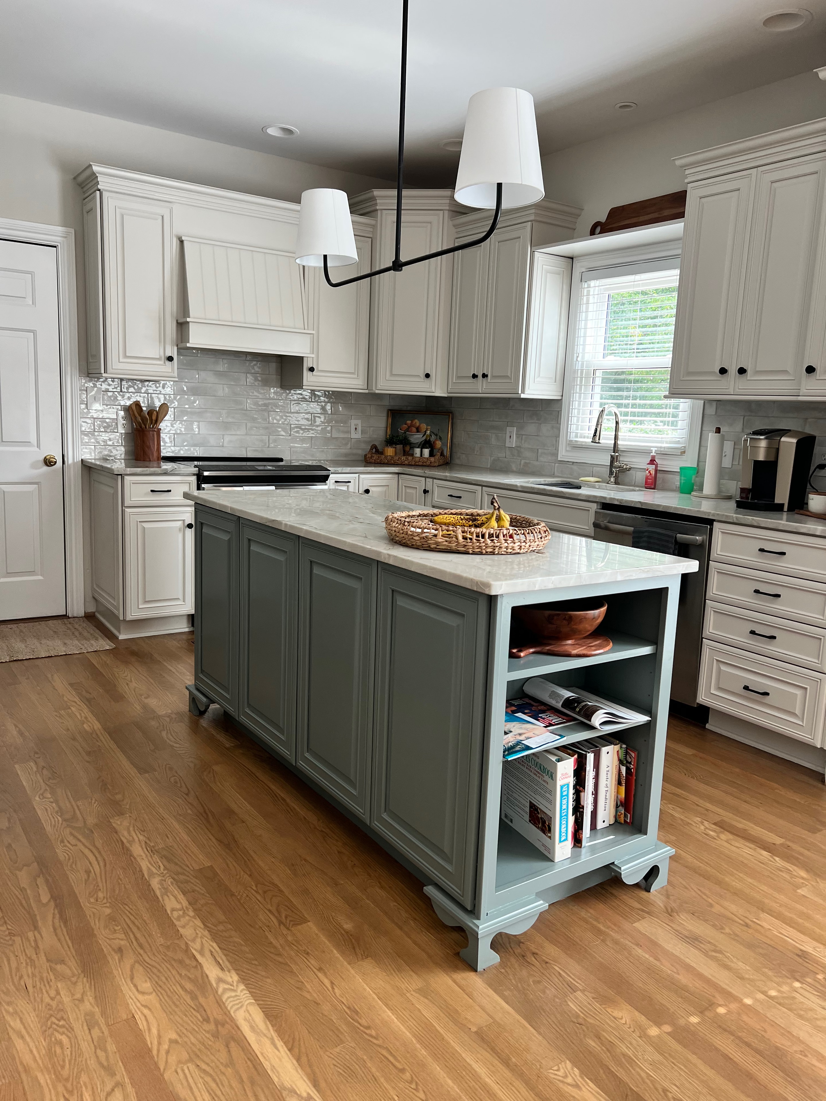 Living Room & Kitchen remodel — kitchen with sage green island and quartz countertops by Luxe Built Louisville KY