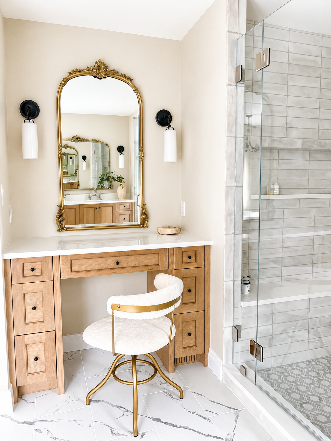 Rolling Hills bathroom — makeup vanity with gold mirror, sconce lighting, and frameless shower